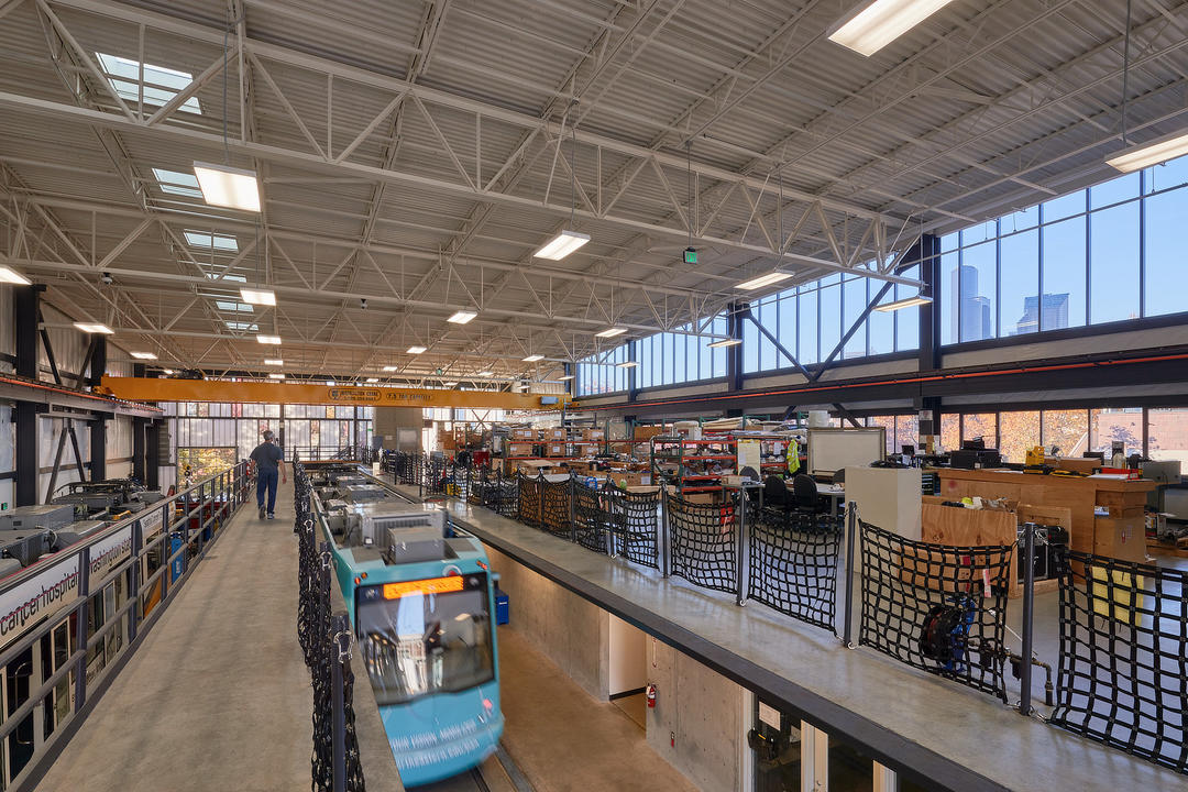 Interior of the First Hill Streetcar facility. Large windows flank the building bringing in day light.