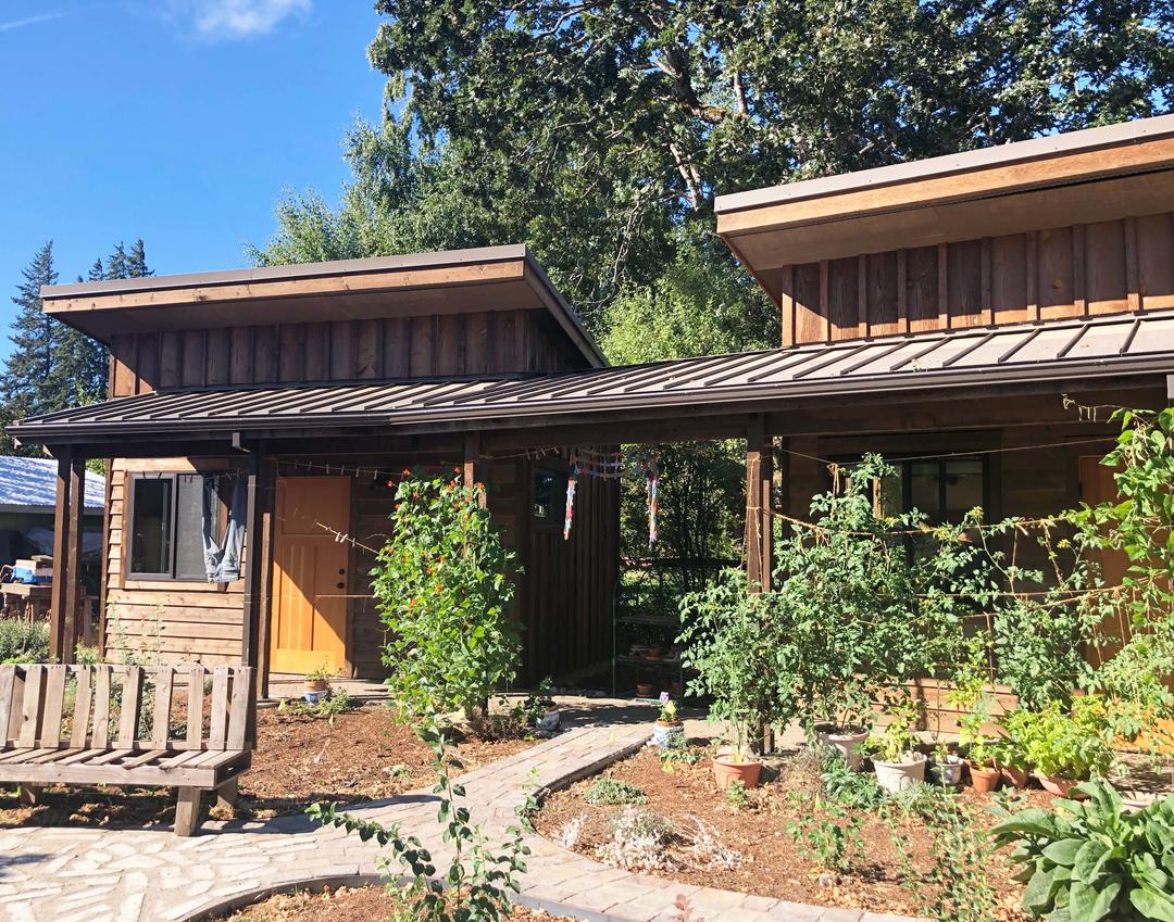 A micro-development on a rural lot with separate rooms connected with a covered breezeway.